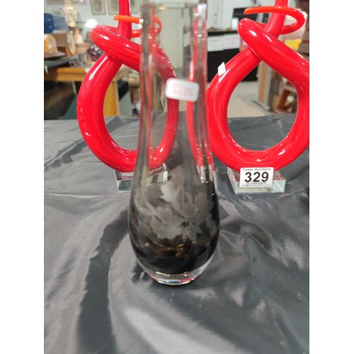 329 - A pair of Murano Venetian twisted red glass ornaments along with a pair of smokey glass vases with e... 