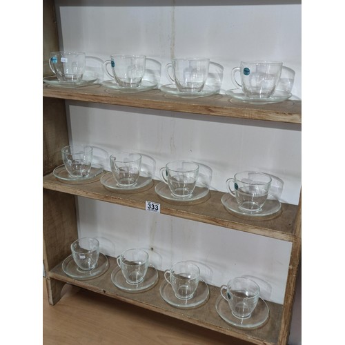 333 - A collection of 12 glass Duralex Gigogne Saint Gobaine Verre tempered glass cups and saucers along w... 