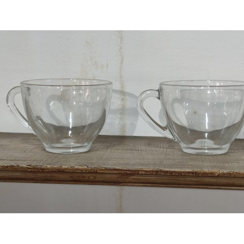 333 - A collection of 12 glass Duralex Gigogne Saint Gobaine Verre tempered glass cups and saucers along w... 