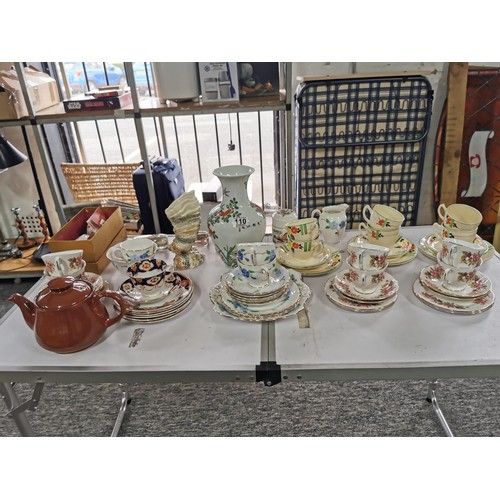 110 - A large quantity of part tea sets to include a mid winter 18 piece set, a Colclough floral design 11... 