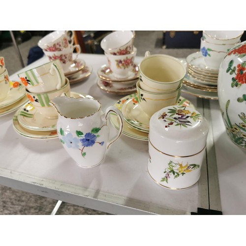 110 - A large quantity of part tea sets to include a mid winter 18 piece set, a Colclough floral design 11... 