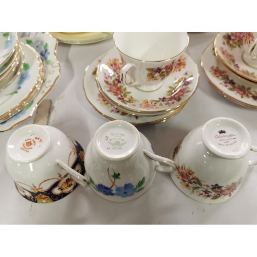 110 - A large quantity of part tea sets to include a mid winter 18 piece set, a Colclough floral design 11... 