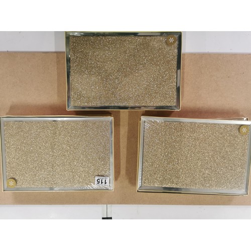 115 - 9 boxes of new and sealed Laura Ashley glass glitter gold 2 set place mats along with a large glitte... 