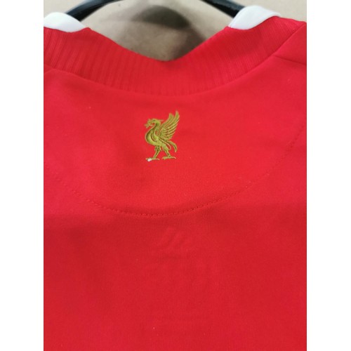 116 - A new with tags Official merchandise Liverpool FC football shirt from 2008 and signed by the players... 