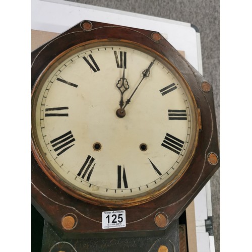 125 - An antique Ansonia drop dial wall clock in mahogany with hand painted dial, striking on a bell and c... 