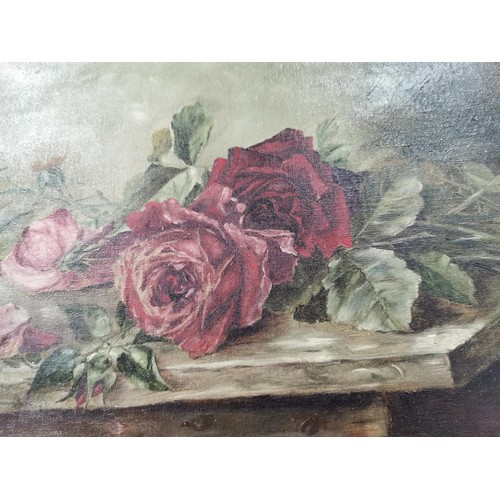 129 - A gilt framed oil on canvas of a still life of roses dating from the late 19th century to early 20th... 