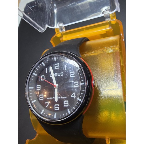 221 - A cased Lorus wristwatch with rubber strap, requires a battery and complete with its Lorus box.