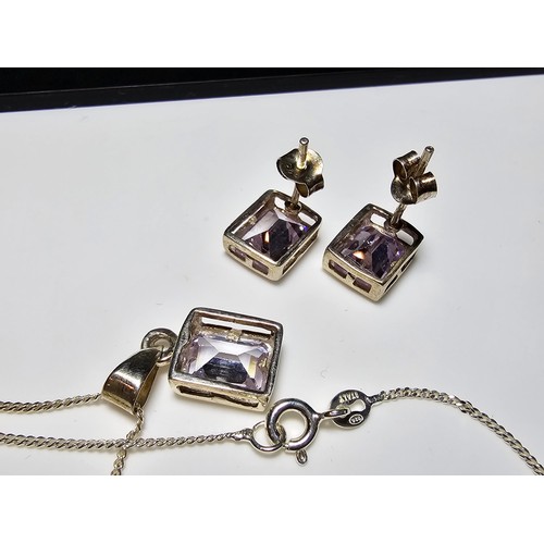 222 - A matching 925 silver necklace and earrings set with Iolite stones, in excellent condition with a 16... 