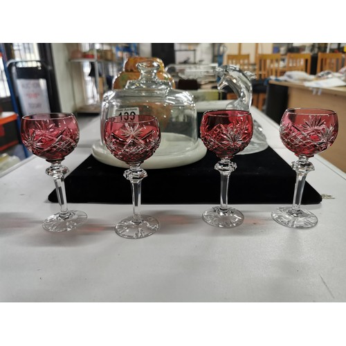 139 - A quantity of collectables including a set of 4 cranberry cut glass crystal sherry glasses along wit... 