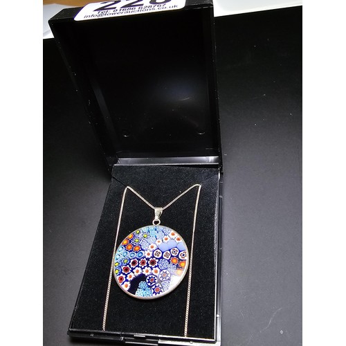 228 - A good quality marked 925 silver Murano glass millefiori double sided pendant on an 18