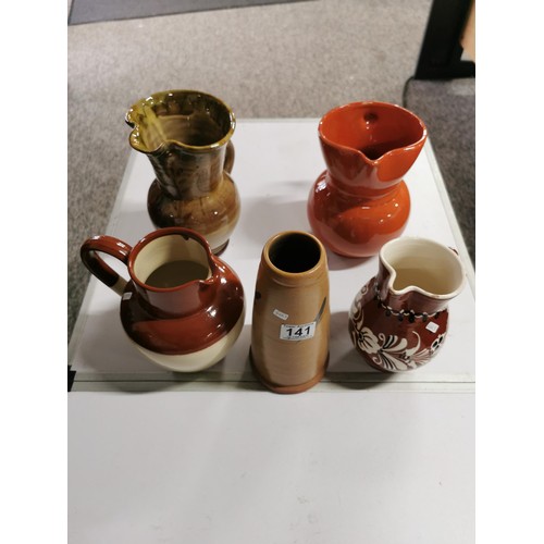 141 - A quantity of collectables including 4 glazed earthenware jugs including 2 studio pottery pieces, 1 ... 