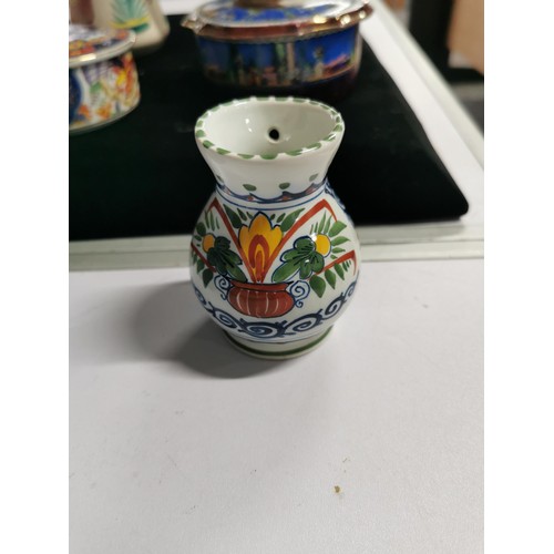 143 - A quantity of collectables including a studio pottery urn a Grecian style hand painted urn, a 2 tone... 