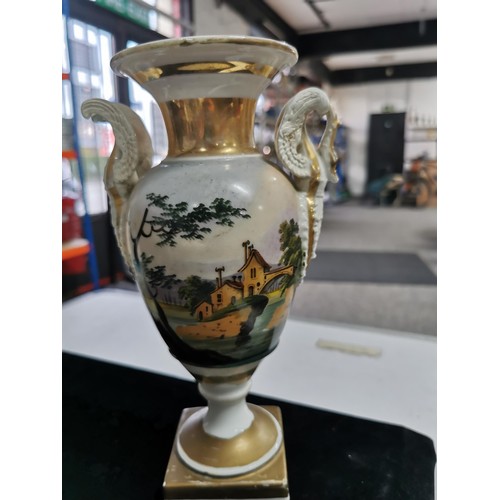 143 - A quantity of collectables including a studio pottery urn a Grecian style hand painted urn, a 2 tone... 