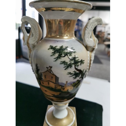 143 - A quantity of collectables including a studio pottery urn a Grecian style hand painted urn, a 2 tone... 