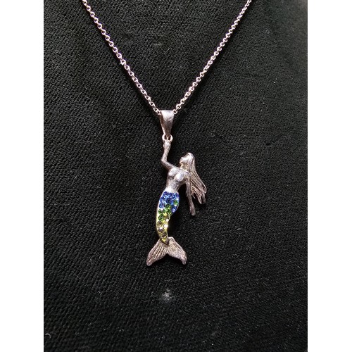 231 - A 925 silver necklace with a mermaid pendant with blue and green CZ stones on a 16