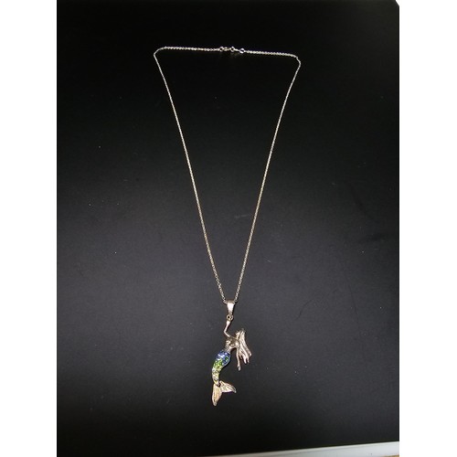 231 - A 925 silver necklace with a mermaid pendant with blue and green CZ stones on a 16