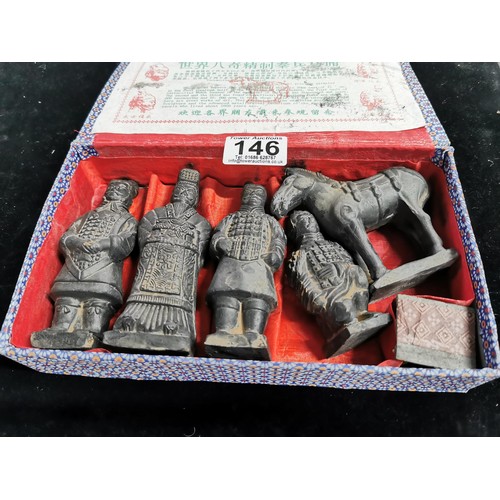 146 - An oriental box containing a quantity of 5 figures from the terracotta warriors. Eight wonder of the... 