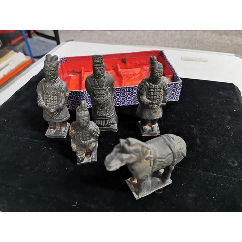 146 - An oriental box containing a quantity of 5 figures from the terracotta warriors. Eight wonder of the... 