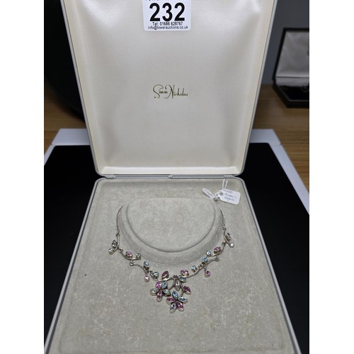 232 - A stunning 925 silver floral design necklace inset with pink white and blue CZ stones, which are spa... 