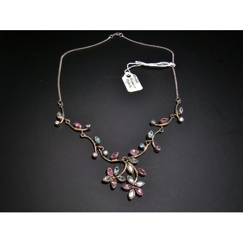 232 - A stunning 925 silver floral design necklace inset with pink white and blue CZ stones, which are spa... 