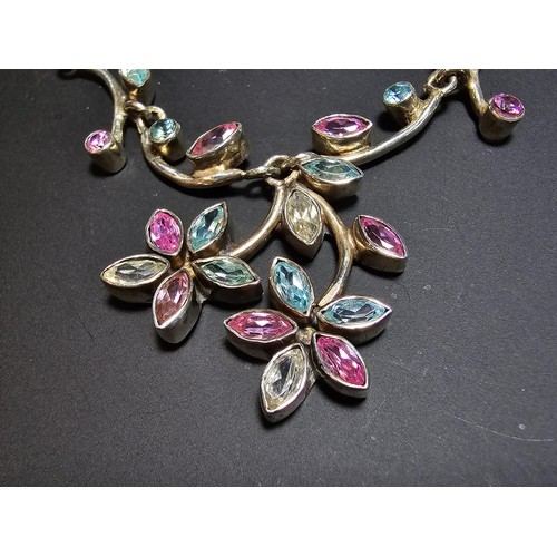 232 - A stunning 925 silver floral design necklace inset with pink white and blue CZ stones, which are spa... 