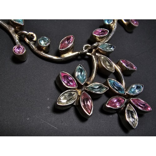 232 - A stunning 925 silver floral design necklace inset with pink white and blue CZ stones, which are spa... 