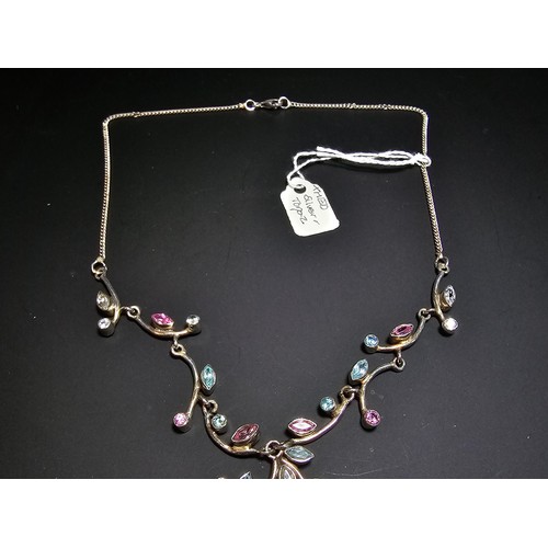 232 - A stunning 925 silver floral design necklace inset with pink white and blue CZ stones, which are spa... 