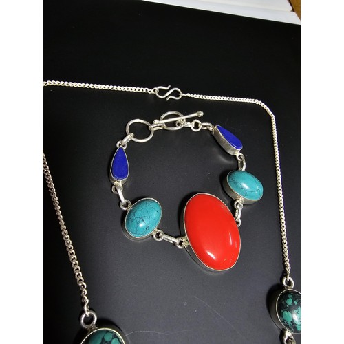 239 - A large and impressive matching 925 silver necklace and bracelet set inset with large turquoise, lap... 