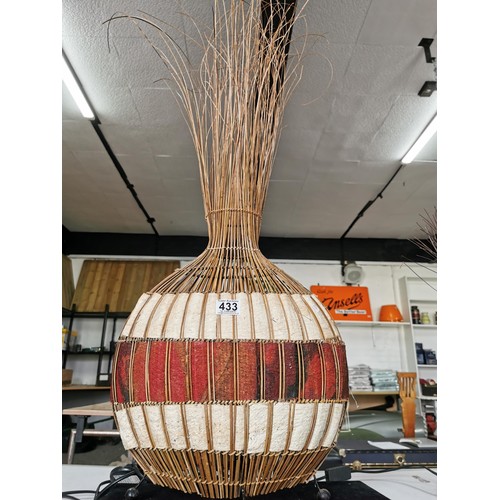 433 - A large tabletop lamp with a natural woven African fabric lamb along with a tall reed formed African... 