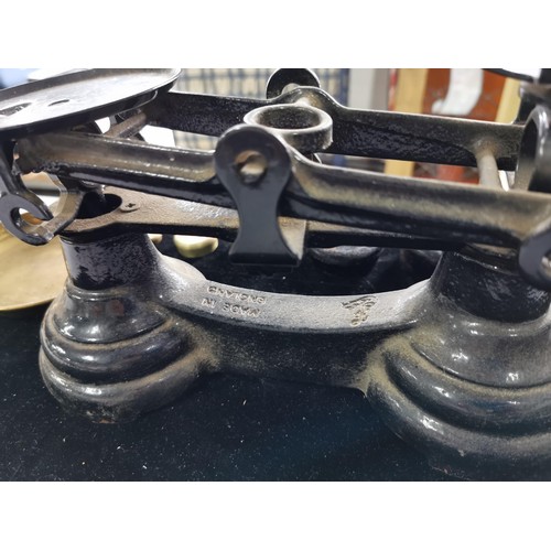 436 - A set of vintage Librasco cast iron scales complete with brass pans and weights. Weight from a quart... 