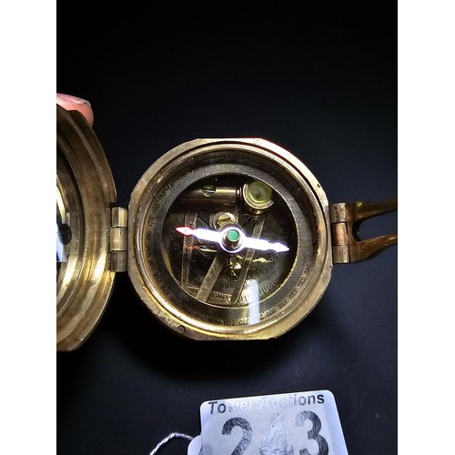 243 - A brass Stanley of London nautical compass complete with leveller.