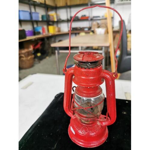 437 - A vintage superbaby oil lamp in red along with a Desmo radilam paraffin heater, both in good order. ... 