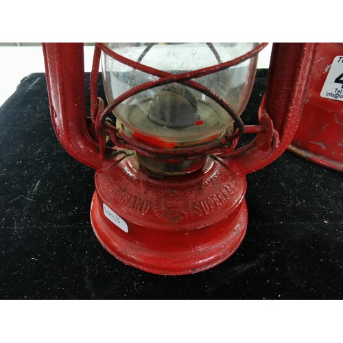 437 - A vintage superbaby oil lamp in red along with a Desmo radilam paraffin heater, both in good order. ... 