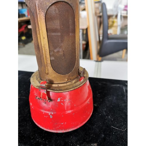 437 - A vintage superbaby oil lamp in red along with a Desmo radilam paraffin heater, both in good order. ... 