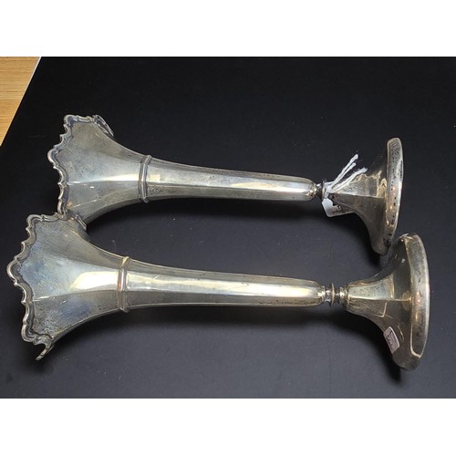 245 - 2x hallmarked silver trumpet vases, with weighted bases, both are hallmarked to the base, the weight... 