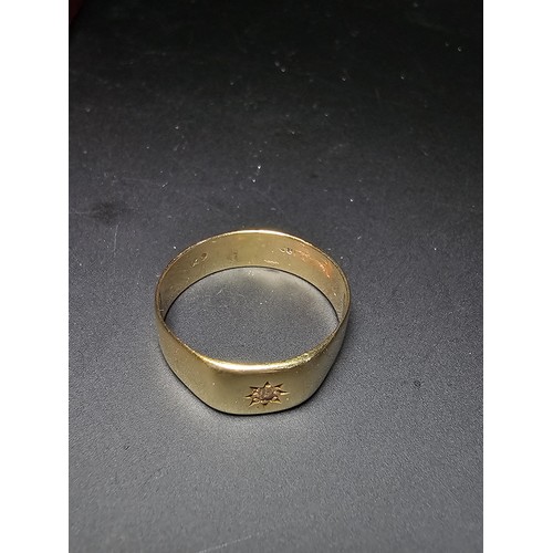 262 - 18ct Yellow Gold Gents Ring inset with a Diamond to the centre. The ring has a weight of 5.24 grams ... 