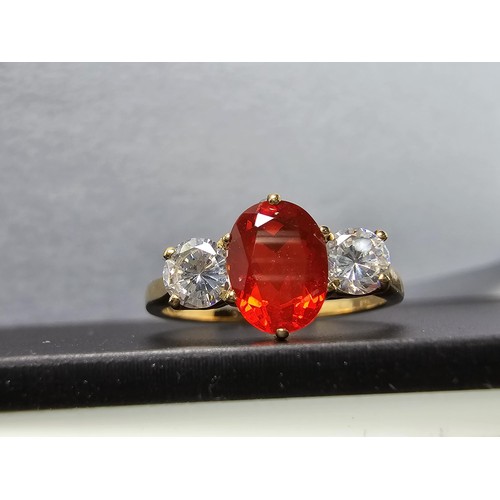 263 - Stunning Hallmarked 9ct Yellow Gold Dress Ring inset with a orange crystal CZ stone and 2x clear cry... 