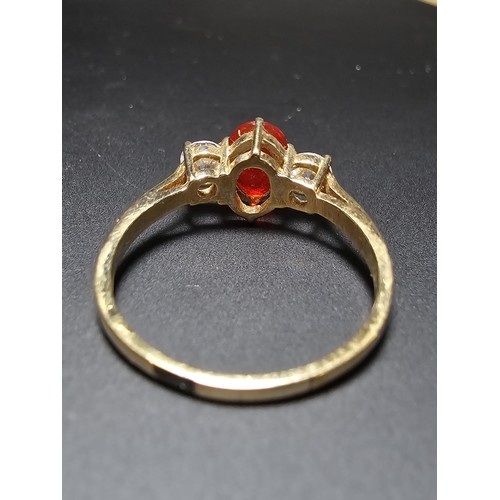 263 - Stunning Hallmarked 9ct Yellow Gold Dress Ring inset with a orange crystal CZ stone and 2x clear cry... 