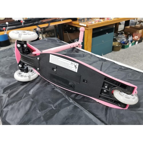 96 - A boxed zinc child's pink scooter with light up wheels. In good overall condition with adjustable ha... 