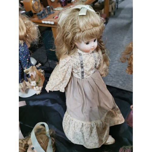 97 - A box containing a quantity of 6 bisque head dolls in various Victorian attire, all are unstamped.