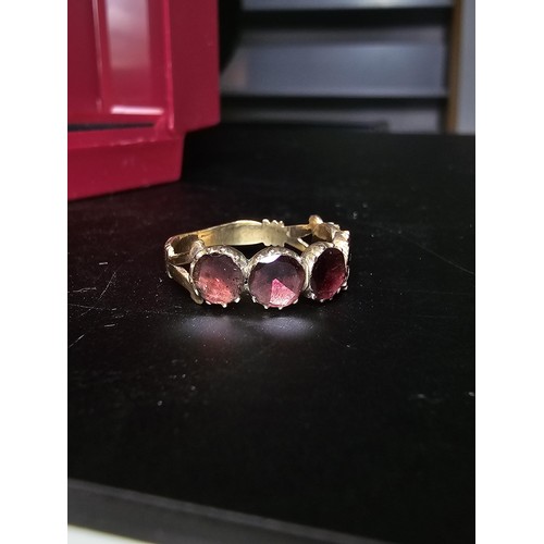 266 - 14ct Yellow Gold Ring inset with 5 Almandine Garnet stones which are faceted flat to the mount, the ... 