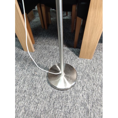 460 - A chrome floor standing lamp with concertina arm in good overall condition and complete with shade. ... 