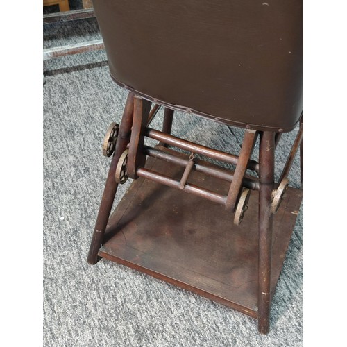 468 - A good quality Edwardian metamorphic child's high chair with a Chesterfield style Rexine seat comple... 