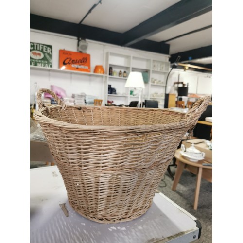 80 - A quantity of wicker ware including 2 ceiling uplighters a large wicker basket, an a double handled ... 