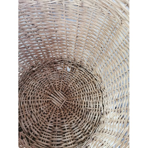 80 - A quantity of wicker ware including 2 ceiling uplighters a large wicker basket, an a double handled ... 