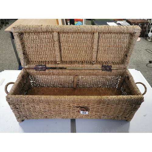 80 - A quantity of wicker ware including 2 ceiling uplighters a large wicker basket, an a double handled ... 