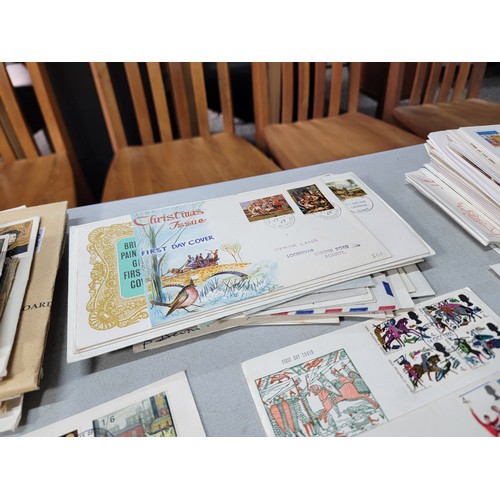 64 - 2x large stacks of Stamped First Day covers mostly are British with a small quantity of world covers... 