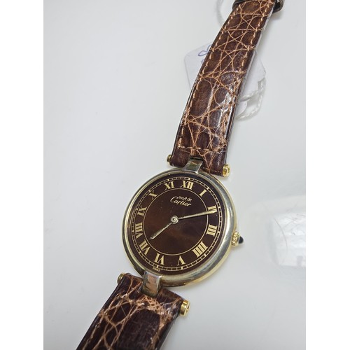 249B - A good quality genuine ladies Cartier watch, 925 silver gold plated with the flower and duck emblem ... 