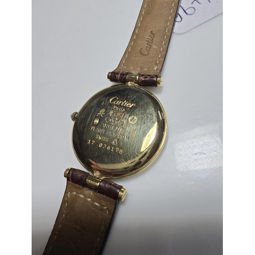 249B - A good quality genuine ladies Cartier watch, 925 silver gold plated with the flower and duck emblem ... 