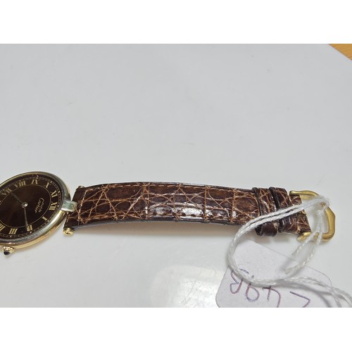 249B - A good quality genuine ladies Cartier watch, 925 silver gold plated with the flower and duck emblem ... 